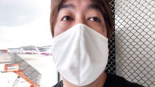 A Man Watches an Airplane at Narita Airport.