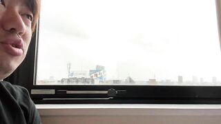 A Man Describing the View from his Hotel in Nippori.