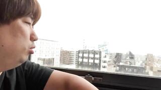 A Man Describing the View from his Hotel in Nippori.