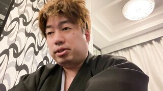 A Man in a Kimono Waiting to be Washed.