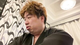 A Man in a Kimono Waiting to be Washed.