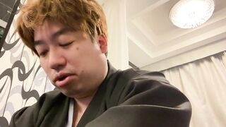 A Man in a Kimono Waiting to be Washed.