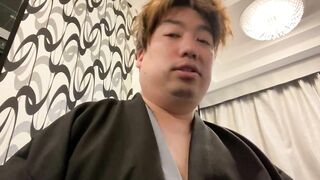 A Man in a Kimono Waiting to be Washed.