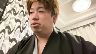 A Man in a Kimono Waiting to be Washed.