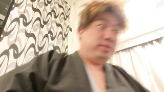 A Man in a Kimono Waiting to be Washed.