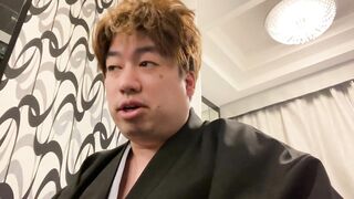 A Man in a Kimono Waiting to be Washed.
