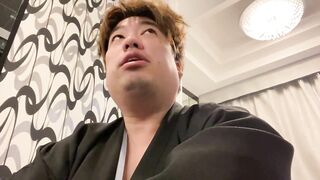A Man in a Kimono Waiting to be Washed.