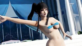 Sexy hot beauty dancing in a small bikini on the beach