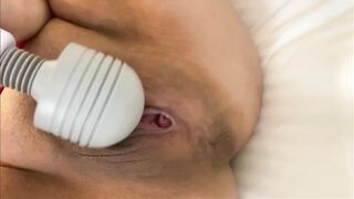 A fair and plump Japanese milf leaks with electric masturbation while making a shaved pussy