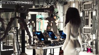 Sex android plays with a sexy busty hottie in restraints in a spacecraft