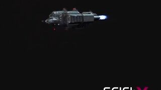 Sex android plays with a sexy busty hottie in restraints in a spacecraft